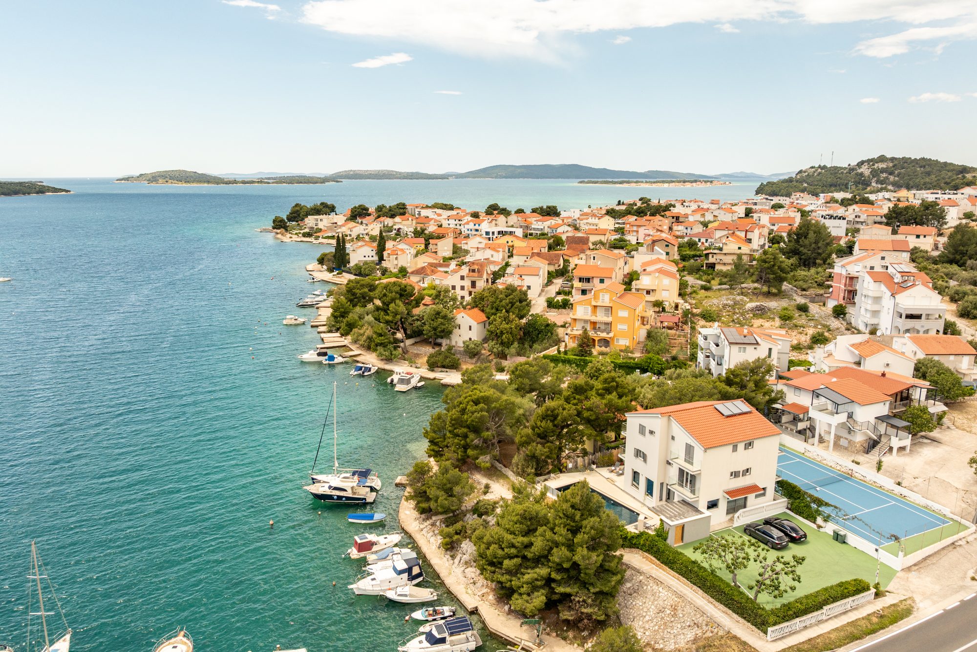 Aerial view of the coastal village of Zaboric with boats, Adriatic islands and the villa